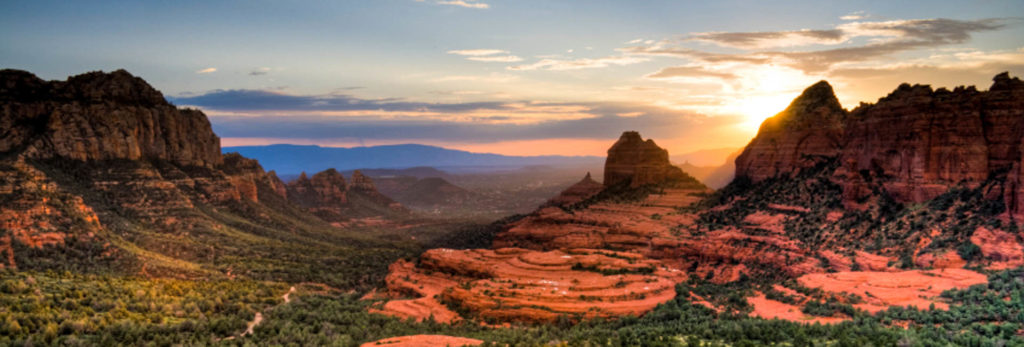 Sunsets over Sedona light up the red rock scenery on this private guided hiking tour.